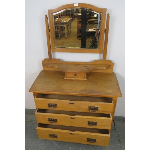 760 - An Edwardian lightwood dressing chest with bevelled mirror, above three long drawers with Art Nouvea... 