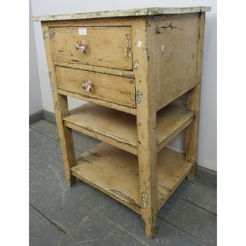 762 - An antique pine artist’s cabinet, painted in a distressed effect, housing two drawers above two open... 