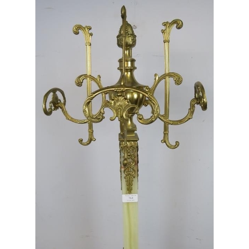 764 - A vintage floor-standing onyx and gilt metal coat stand, having four rotating hooks with an asparagu... 