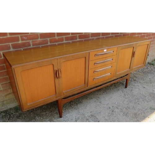 772 - A mid-century teak ‘Fresco’ sideboard by G-Plan, housing four long drawers flanked by cupboard with ... 