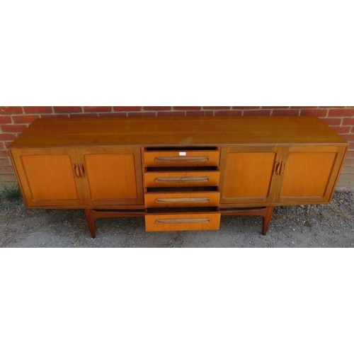 772 - A mid-century teak ‘Fresco’ sideboard by G-Plan, housing four long drawers flanked by cupboard with ... 