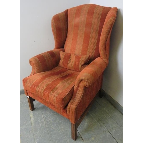 773 - A good quality Georgian-style wingback armchair by Artistic Upholstery, upholstered in striped terra... 