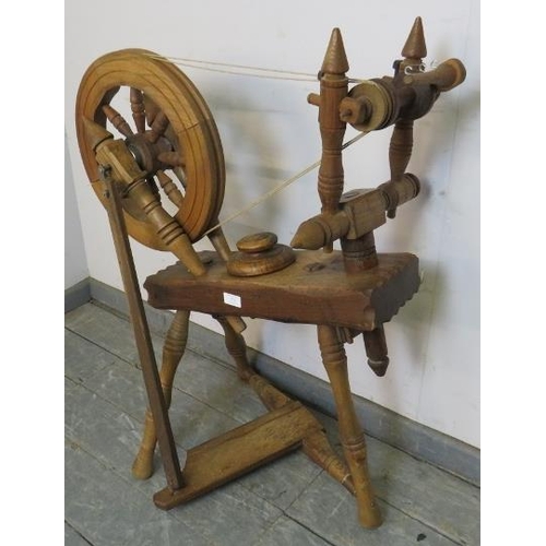 774 - A bespoke antique-style medium oak spinning wheel. 
H90cm W48cm D74cm (approx).
Condition report: No... 