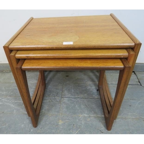 780 - A set of three mid-century teak ‘Quadrille’ G-Plan nesting tables, on rail supports. 
H49cm W53cm D4... 