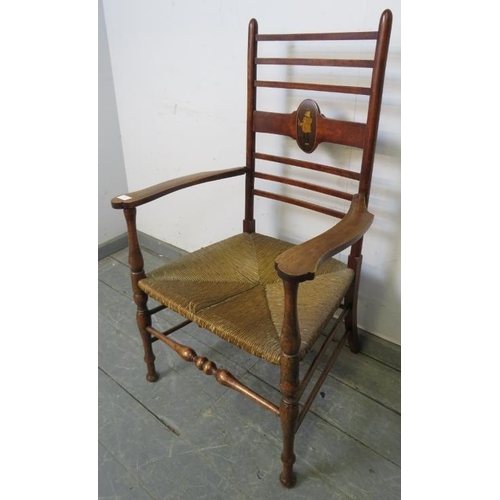 781 - A turn of the century mahogany open-sided armchair, the ladder back with marquetry inlay depicting a... 