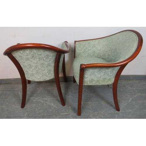 785 - A pair of Parker Knoll mahogany tub chairs in the Regency taste, upholstered in paisley material, on... 