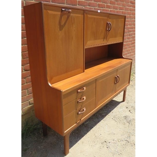 790 - A mid-century afromosia teak crossbanded highboard by G Plan, housing a fall-front cupboard and a fu... 