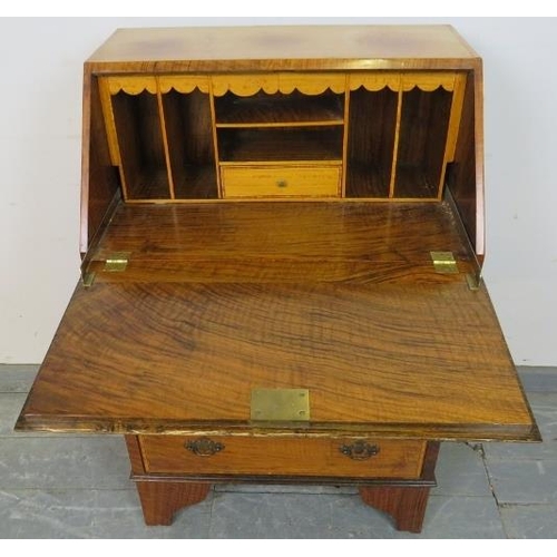 792 - An Edwardian rosewood bureau of small proportions, cross banded, strung with satinwood and featuring... 