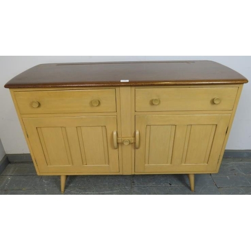 801 - A mid-century elm and beech sideboard by Ercol, housing two short drawers over cupboards with panell... 