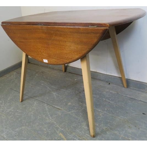 808 - A mid-century elm and beech circular drop-leaf Windsor dining table by Ercol, on tapering canted sup... 