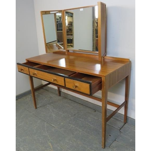 810 - A mid-century teak dressing table by Loughborough for Heal & Son, having an adjustable triptych mirr... 