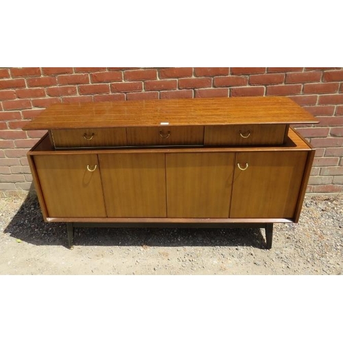 821 - A mid-century teak ‘Librenza’ sideboard by G Plan, housing three short drawers above bi-folding cupb... 