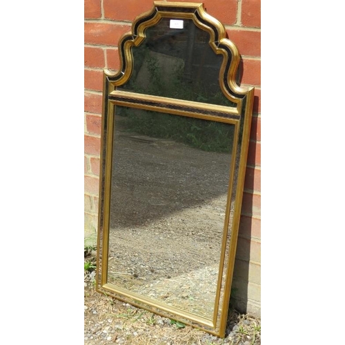 826 - A Continental wall mirror, within a double giltwood surround enclosing sectioned glass with an antiq... 