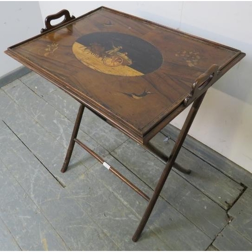 828 - A Georgian walnut marquetry inlaid butler’s tray on stand, one side depicting a hay wagon and horses... 