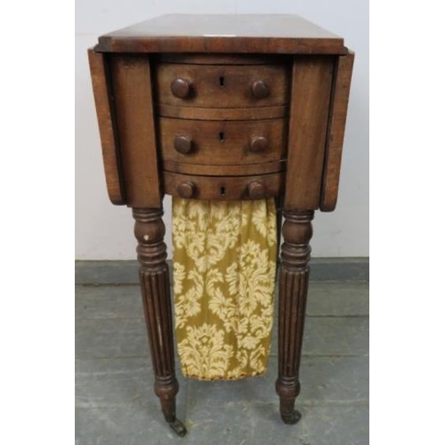 829 - A William IV mahogany drop-leaf worktable, housing two short drawers with tapestry storage well unde... 