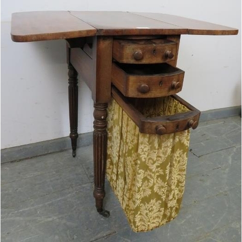 829 - A William IV mahogany drop-leaf worktable, housing two short drawers with tapestry storage well unde... 