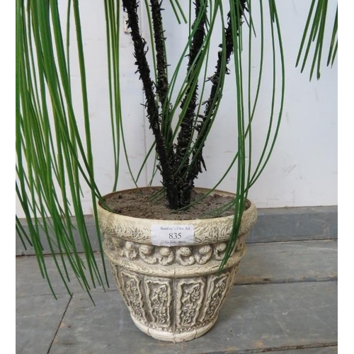 835 - An artificial ponytail palm tree in a relief moulded planter.
H120cm (approx).
Condition report: No ... 