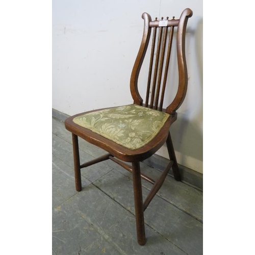 839 - An unusual turn of the century fruitwood lyre-backed chair of small proportions, with tapestry seat,... 