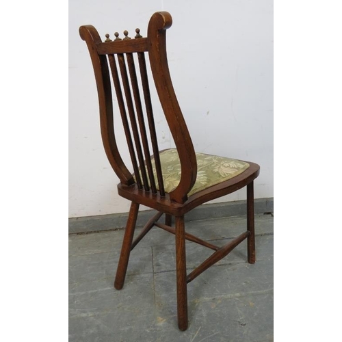 839 - An unusual turn of the century fruitwood lyre-backed chair of small proportions, with tapestry seat,... 