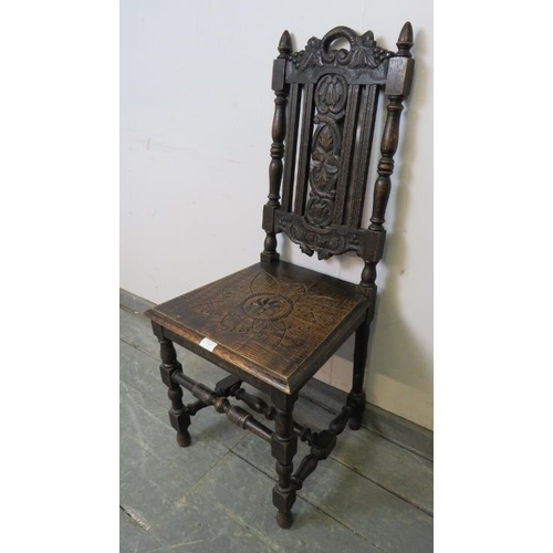 840 - A 19th century oak hall chair, the carved back splat depicting fruiting vines, on 
turned and block ... 