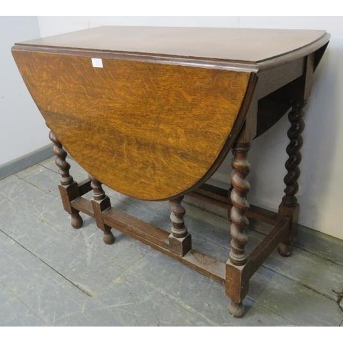 849 - A 19th century oak oval gate leg table on barley twist supports with stretchers. 
H73cm W91cm D42-11... 