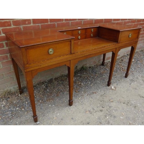 853 - A Regency Period walnut writing table, strung with parquetry and herringbone inlay, housing six shor... 