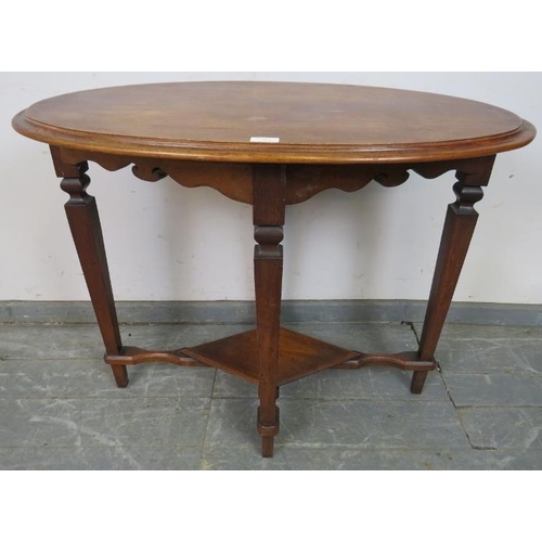 859 - An Arts & Crafts oak and mahogany oval occasional table, on tapering square supports united by a dia... 