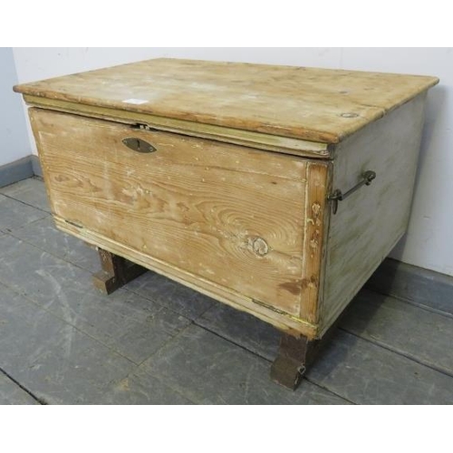 866 - An antique stripped pine flat top trunk with fall front, on rail supports with parquetry inlay. 
H45... 