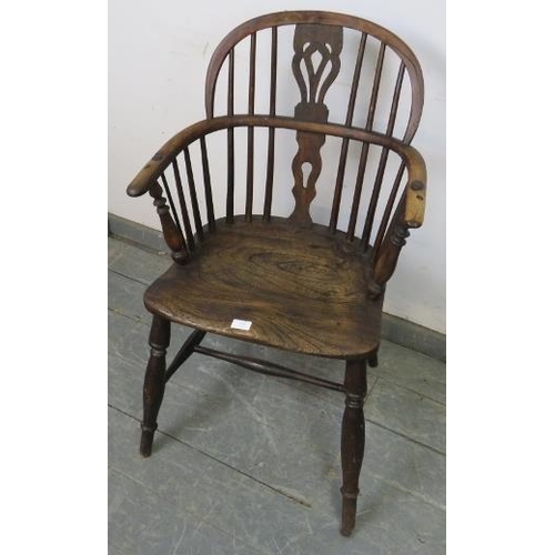 870 - An early 19th century elm and yew wood Windsor hoop-back chair, on turned canted supports with an ‘H... 