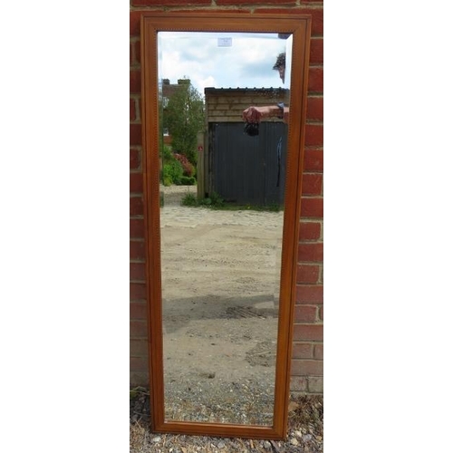 878 - An Arts & Crafts satin walnut rectangular bevelled wall mirror, strung with ebony and parquetry inla... 