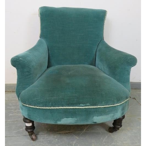 885 - A Victorian low armchair with scrolled back, upholstered in teal velvet material with silver braidin... 