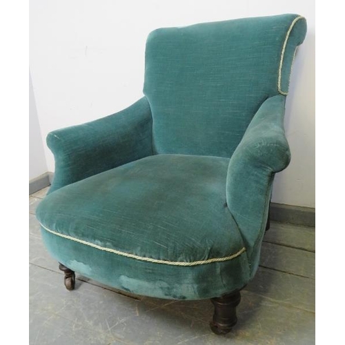 885 - A Victorian low armchair with scrolled back, upholstered in teal velvet material with silver braidin... 