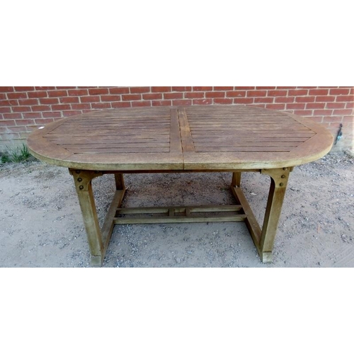 891 - A good quality weathered teak extending outdoor table by Royal Botania, with butterfly folding centr... 