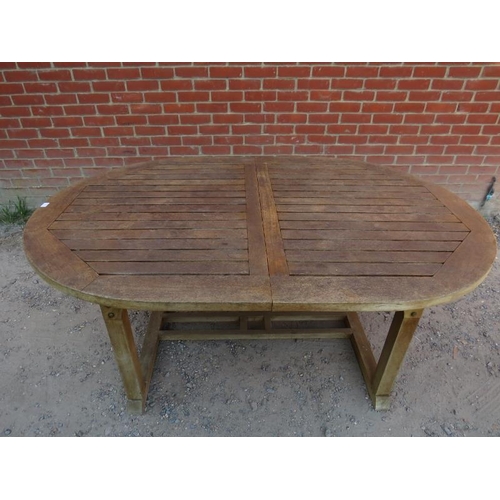 891 - A good quality weathered teak extending outdoor table by Royal Botania, with butterfly folding centr... 