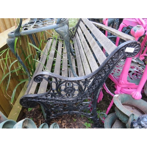 896 - A vintage wrought iron scroll back garden bench with pierced end supports and teak slatted seat.
Hei... 