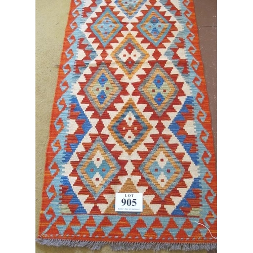 905 - A Chobi Kilim runner, good colours and excellent condition. 204cm x 68cm.