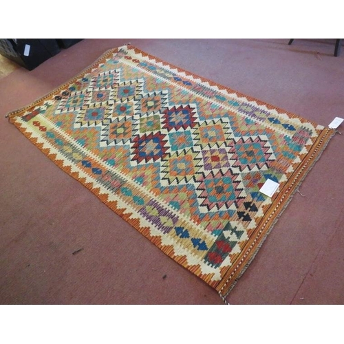 929 - A fine Anatolian Turkish Kilim rug, vibrant colours and in good condition. 193cm x 120cm.