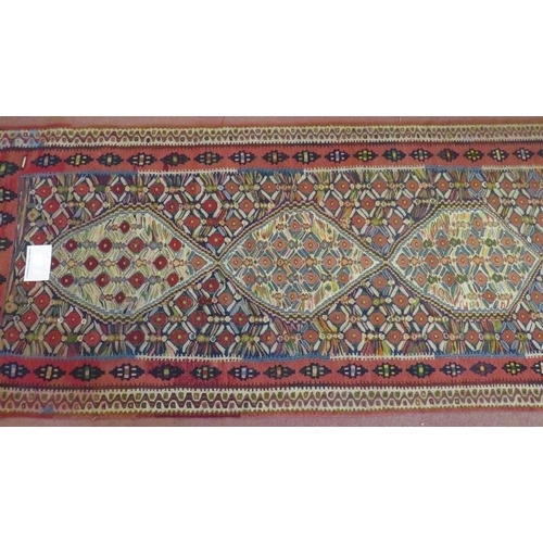 930 - A good North West Persian Senneh Kilim runner, 7 central panels on a patterned ground and in good co... 