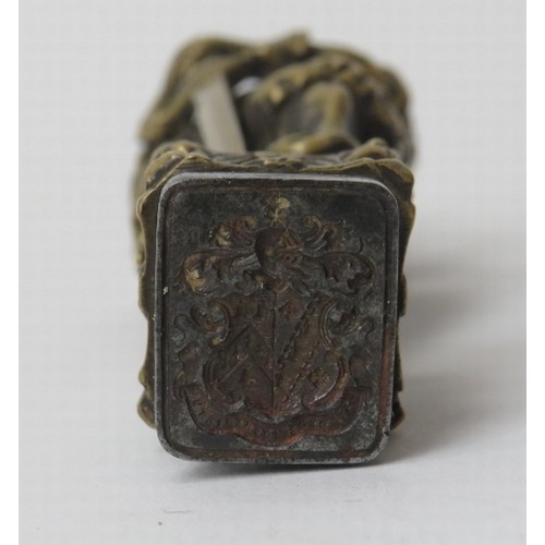 174 - A large brass and wrought iron heraldic wax seal. Modelled in the form of a European knight in armou... 