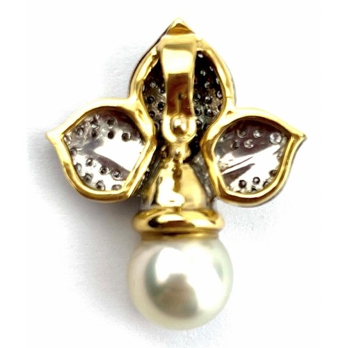 369 - A yellow metal diamond & pearl pendant in the fleur de Lis style. The central pearl approx 12mm acro... 