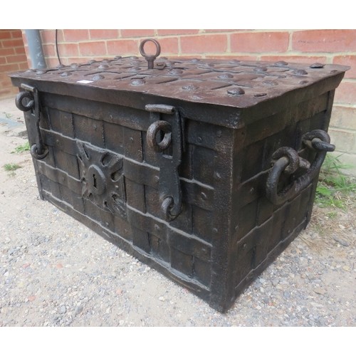 720A - A late 17th/early 18th century Armada chest, of cast iron strapwork construction, the lid with 7-poi... 