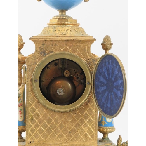 101 - A French ormolu and porcelain mantle clock, 19th century. Modelled in the Neoclassical style with ha... 