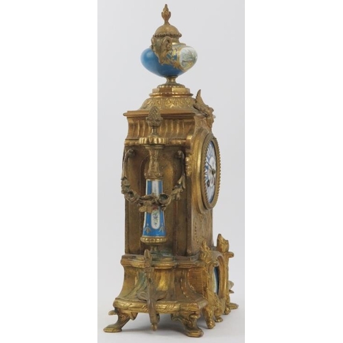 101 - A French ormolu and porcelain mantle clock, 19th century. Modelled in the Neoclassical style with ha... 