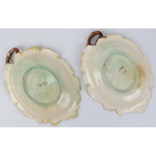 112 - A pair of large majolica leaf and acorn serving dishes, 19th century. 31.5 cm length. (2 items).
Con... 