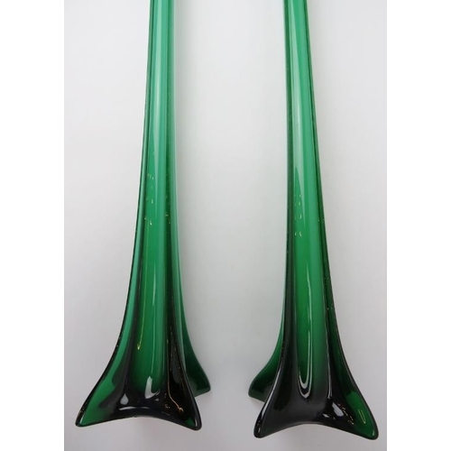 113 - A very large European pair of emerald green glass floor standing vases, 20th century. Of tall, slend... 