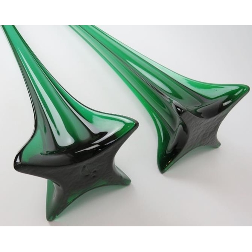 113 - A very large European pair of emerald green glass floor standing vases, 20th century. Of tall, slend... 