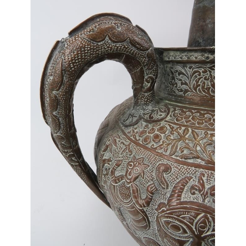 119 - A large Indian Kindi ritual decanter vessel, 19th century or earlier. Embossed with decorative bands... 