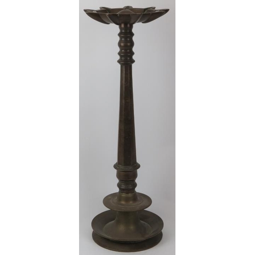 120 - An Indian bronze floor standing temple 'Puja' oil lamp with nine wick diya reservoir, 19th century. ... 