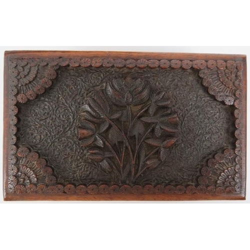 122 - Two Indian carved wood objects,  20th century. Comprising an ornately carved box with hidden sliding... 