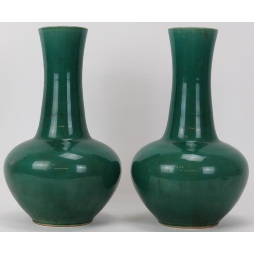 126 - A pair of Chinese style apple green glazed ceramic vases, 20th century. (2 items) 31.3 cm height. 
C... 